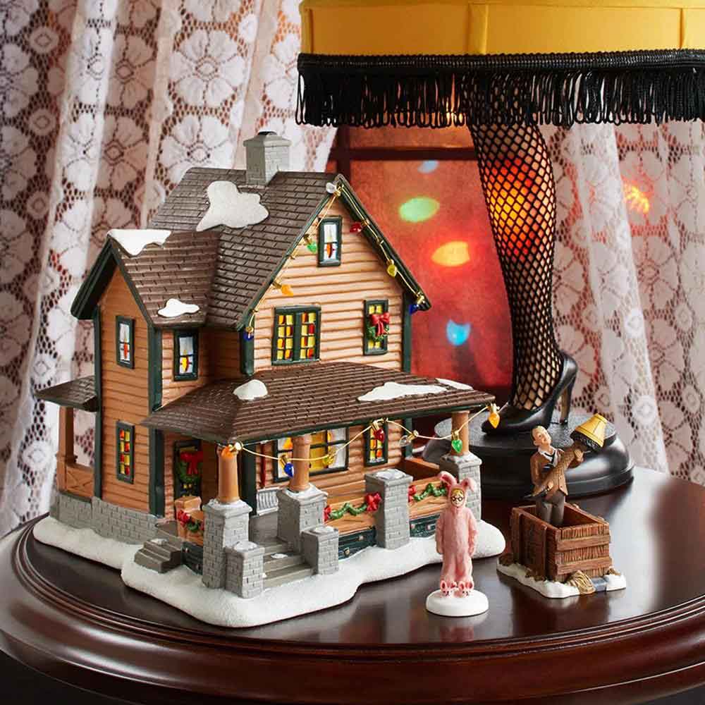 Ralphie’s House village piece lit up with leg lamp and Christmas decorations