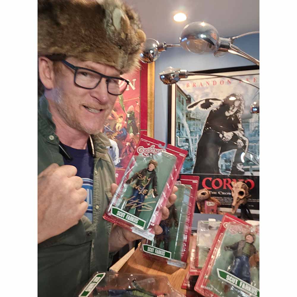 Close-up of autographed NECA Scut Farkus figure with original packaging, signed by Zack Ward with gold ink